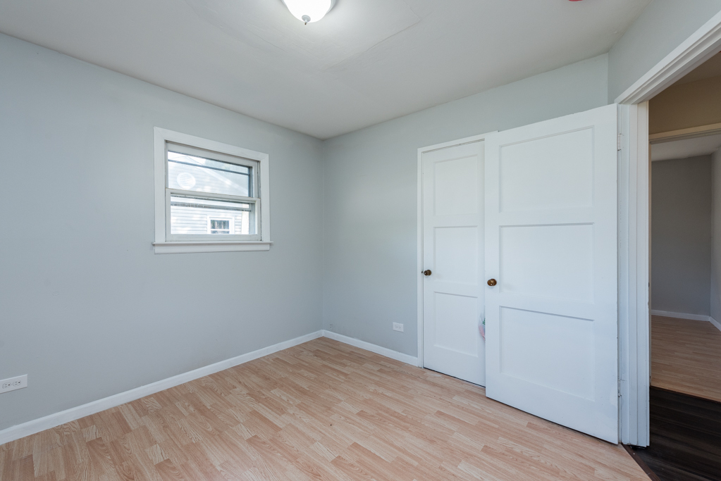 1636 Rice Street Waukegan, IL 60087 - Photo 17 of 26 a view of empty room with wooden floor