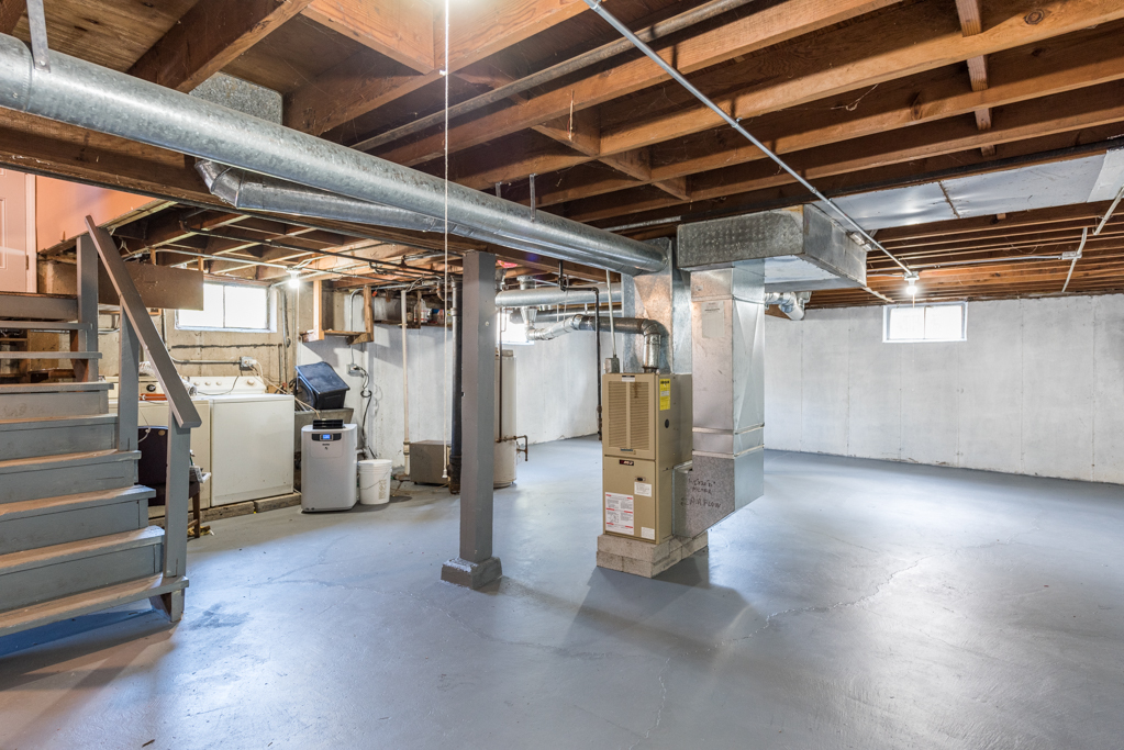 1636 Rice Street Waukegan, IL 60087 - Photo 19 of 26 a view of water heater room with stairs