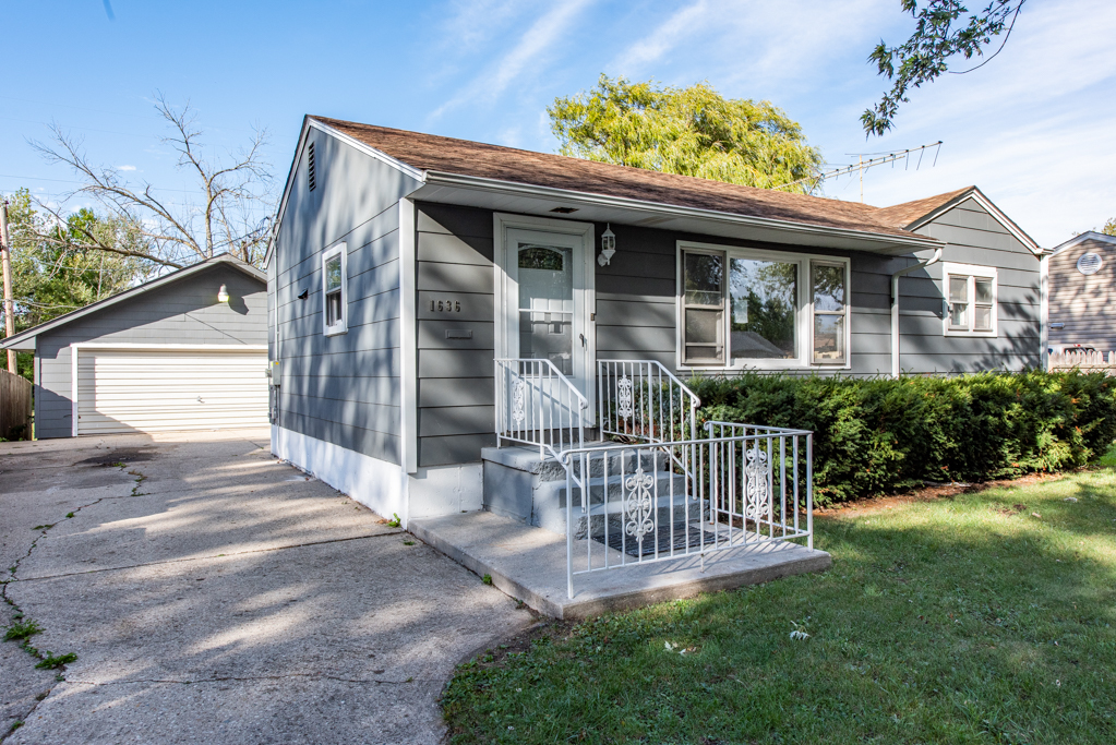 1636 Rice Street Waukegan, IL 60087 - Photo 3 of 26 a front view of a house with a porch