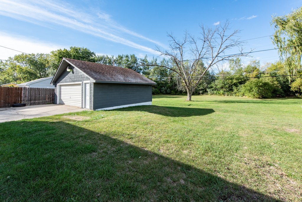 1636 Rice Street Waukegan, IL 60087 - Photo 23 of 26 a front view of a house with a yard