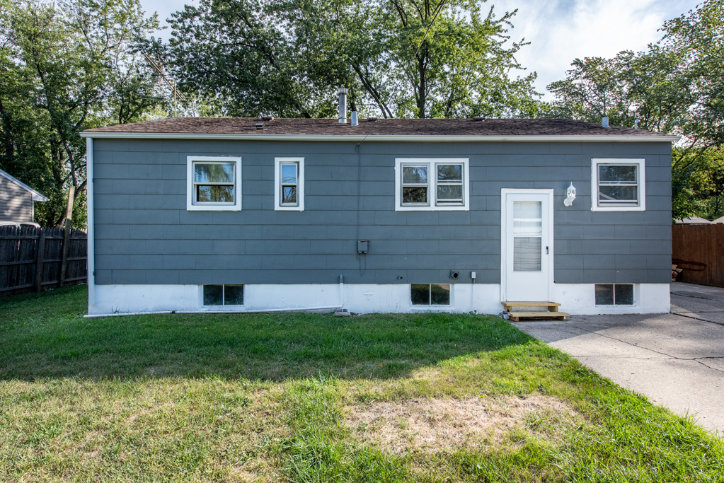 1636 Rice Street Waukegan, IL 60087 - Photo 24 of 26 a front view of a house with a yard