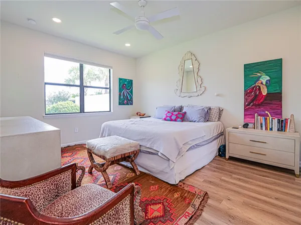 a bedroom with a bed and a table