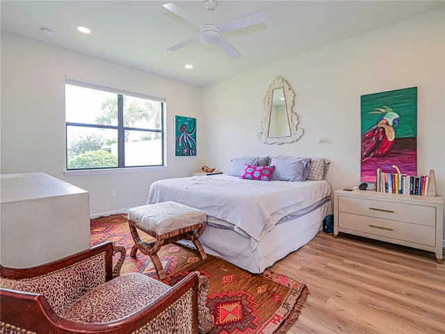 a bedroom with a bed and a table