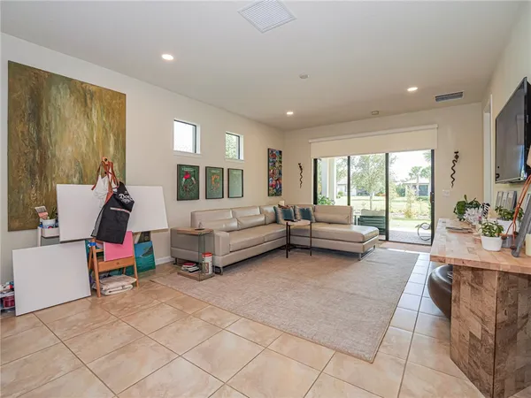 a bedroom with furniture and windows