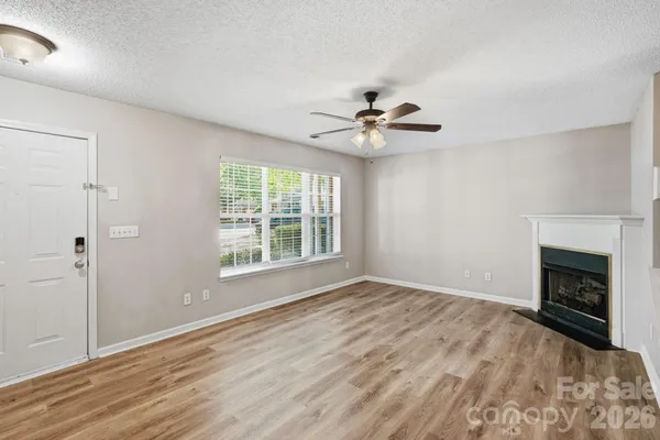 a kitchen with stainless steel appliances a sink stove refrigerator and cabinets