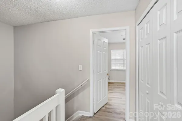 a bathroom with a sink a toilet a large mirror and shower