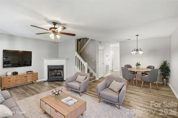 a view of a livingroom with furniture and a chandelier