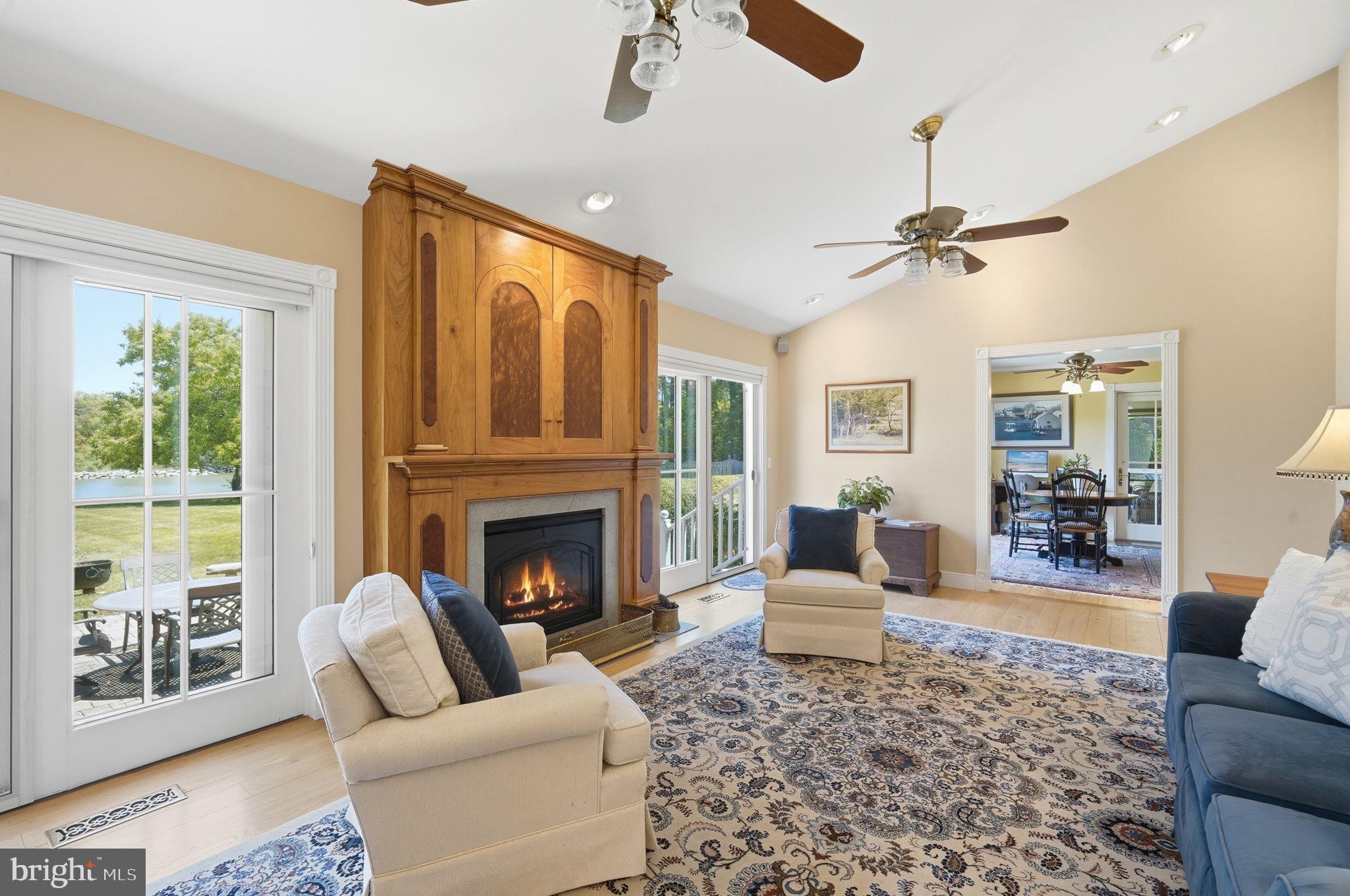 26226 Langs Landing Road Oxford, MD 21654 - Photo 11 of 48 a living room with furniture and a fireplace