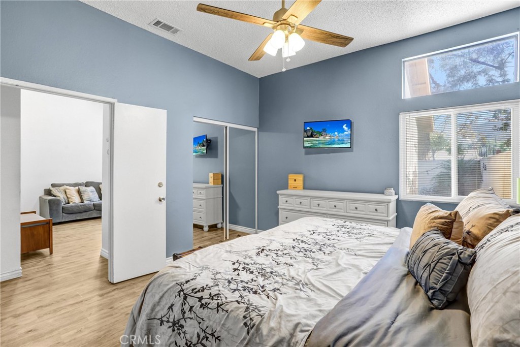 14519 El Contento Avenue Fontana, CA 92337 - Photo 15 of 30 a bedroom with a bed and a television