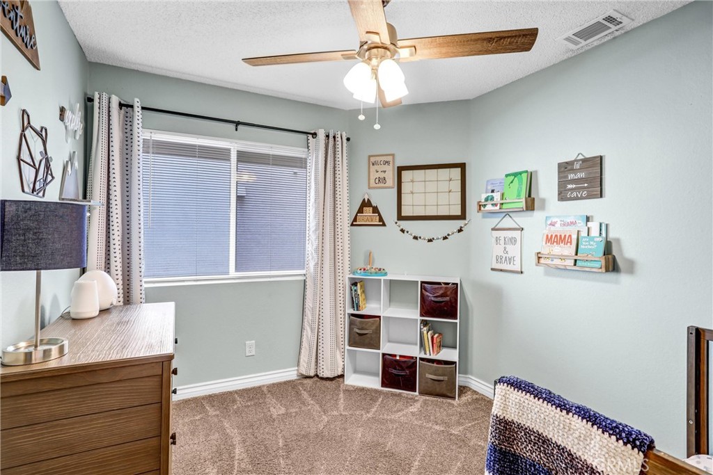 14519 El Contento Avenue Fontana, CA 92337 - Photo 17 of 30 a room with furniture and window