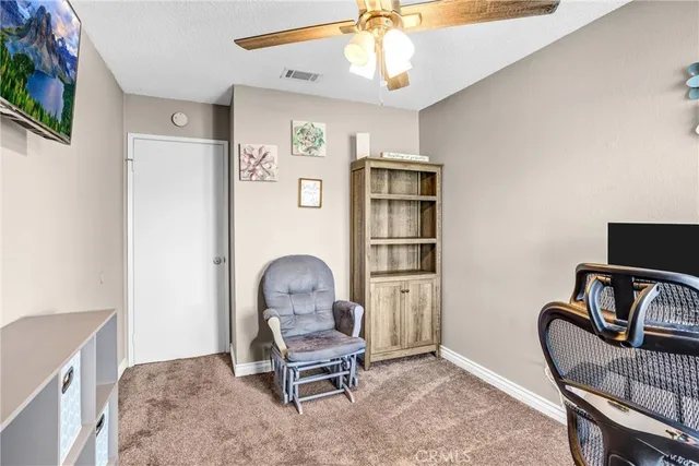 a workspace room with furniture