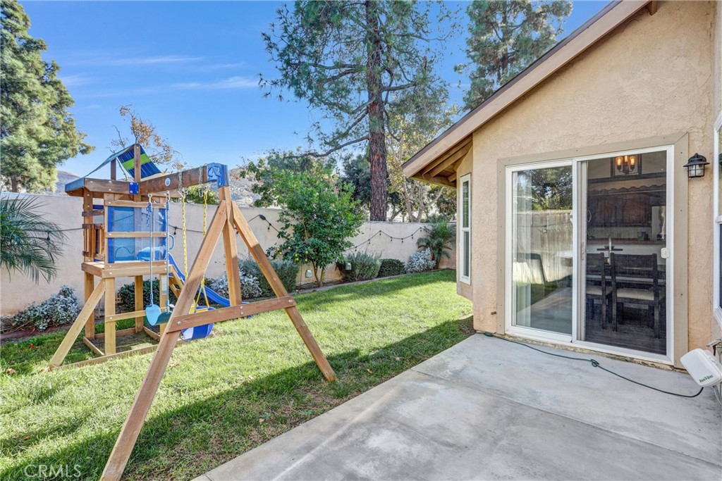 14519 El Contento Avenue Fontana, CA 92337 - Photo 23 of 30 a view of a house with backyard and porch