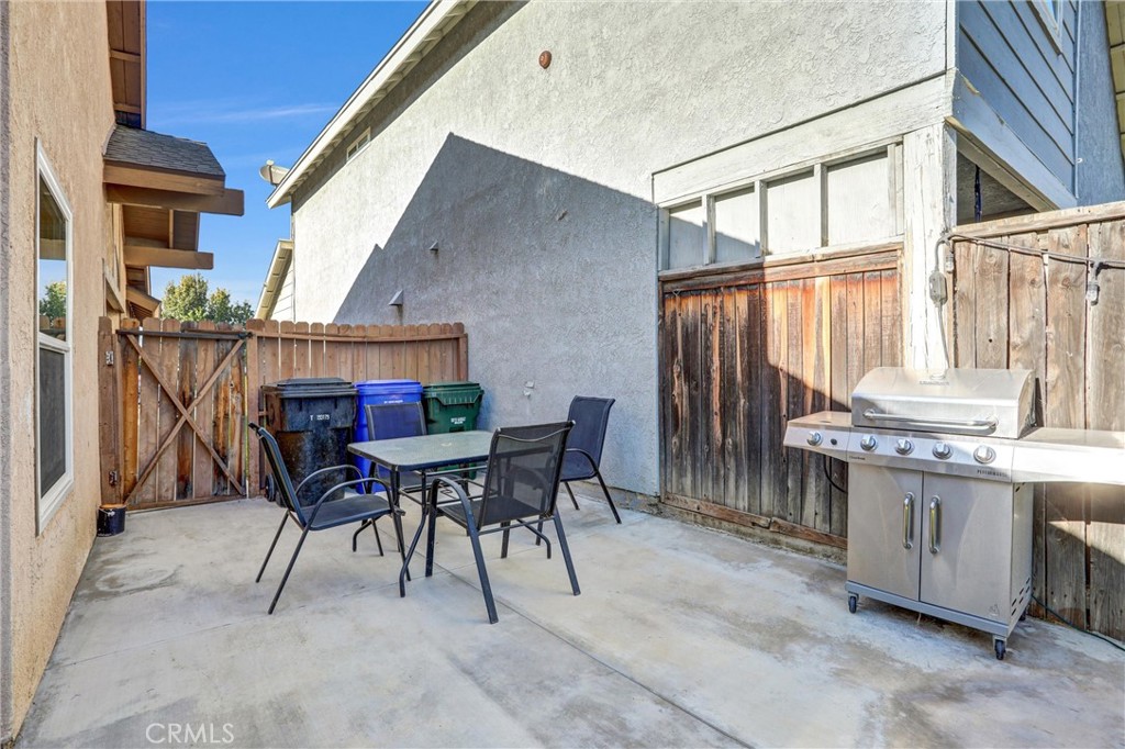 14519 El Contento Avenue Fontana, CA 92337 - Photo 24 of 30 a view of an outdoor dining space with a patio