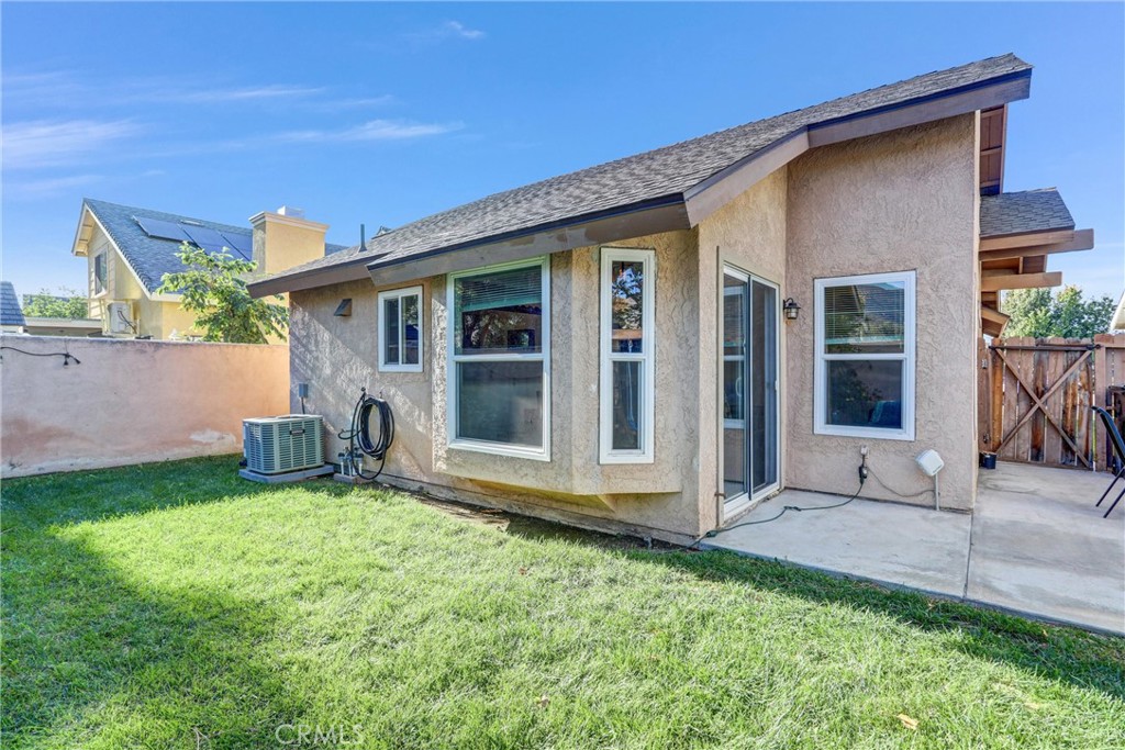 14519 El Contento Avenue Fontana, CA 92337 - Photo 25 of 30 a view of a house with yard and sitting area