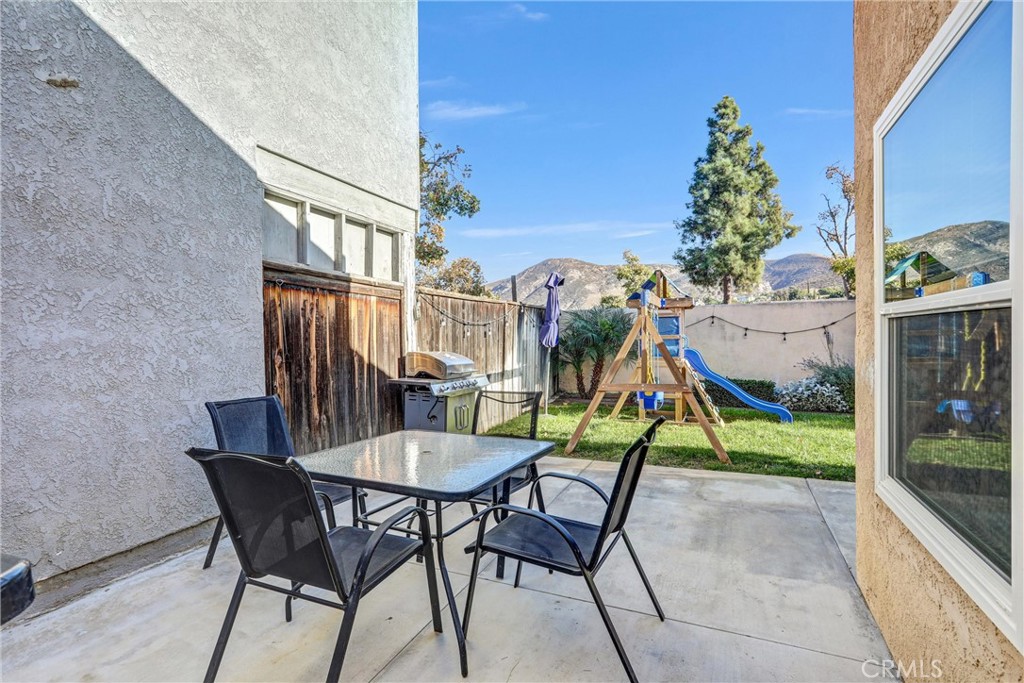 14519 El Contento Avenue Fontana, CA 92337 - Photo 28 of 30 a view of a chairs and table in patio