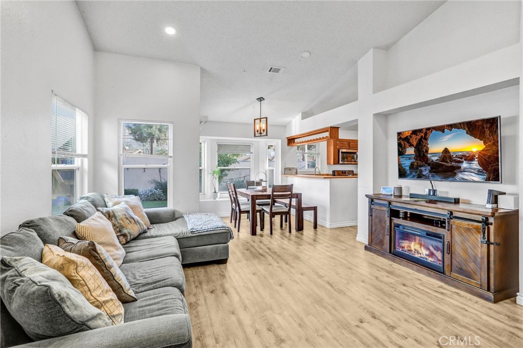 14519 El Contento Avenue Fontana, CA 92337 - Photo 5 of 30 a living room with furniture and a flat screen tv