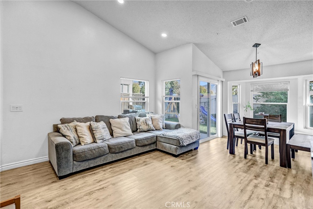14519 El Contento Avenue Fontana, CA 92337 - Photo 6 of 30 a living room with furniture and a large window