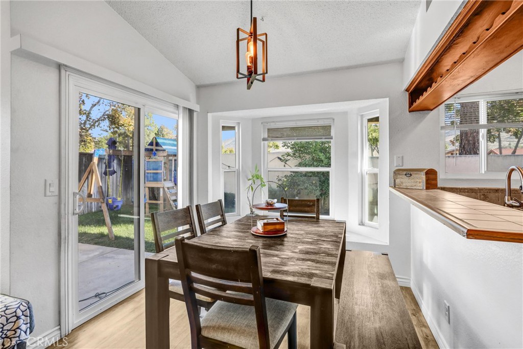 14519 El Contento Avenue Fontana, CA 92337 - Photo 8 of 30 a view of a dining room with furniture window and outside view