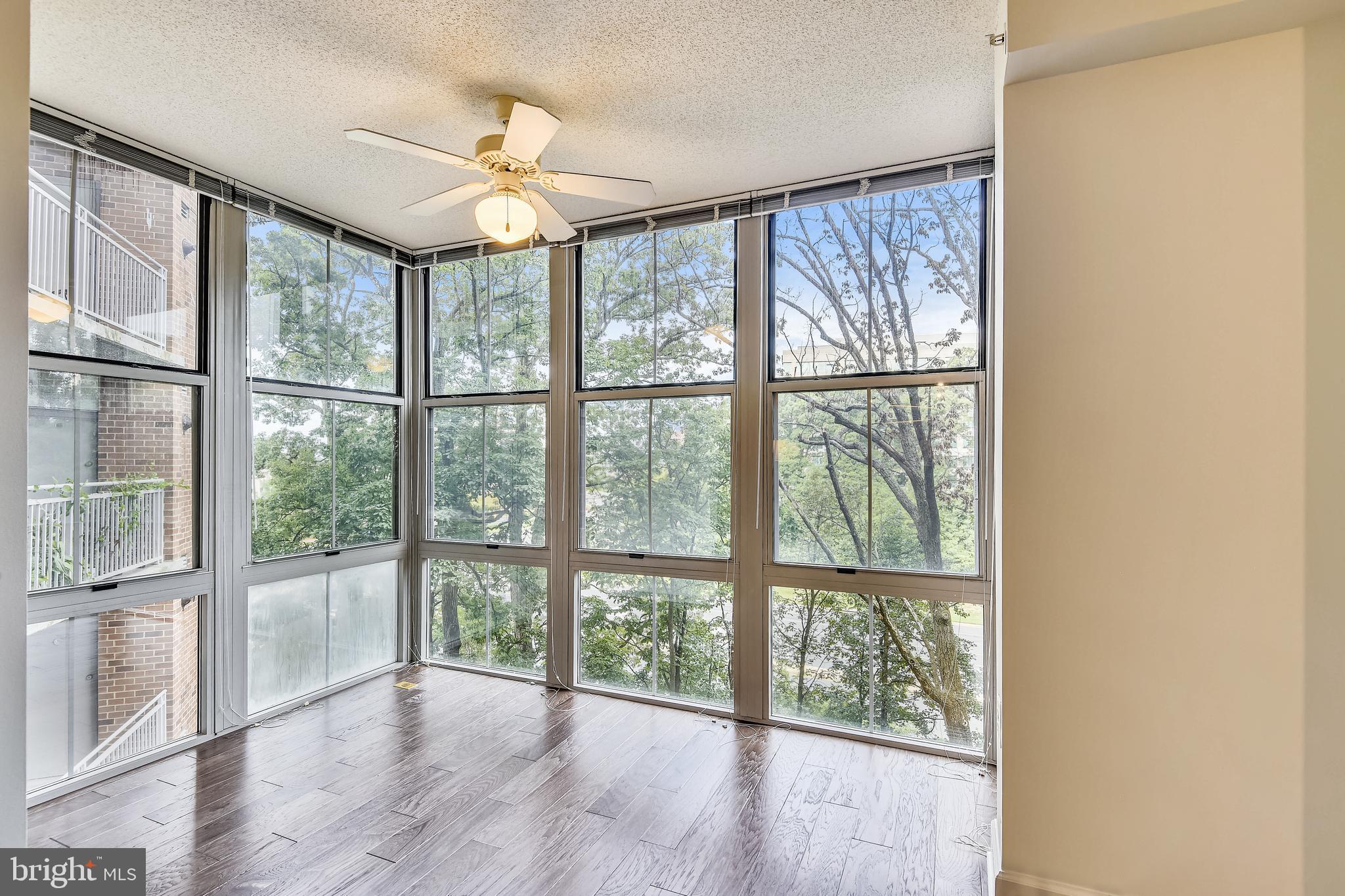 11800 Sunset Hills Road, Unit 712 Reston, VA 20190 - Photo 3 of 35 Sunroom/office with floor to ceiling windows