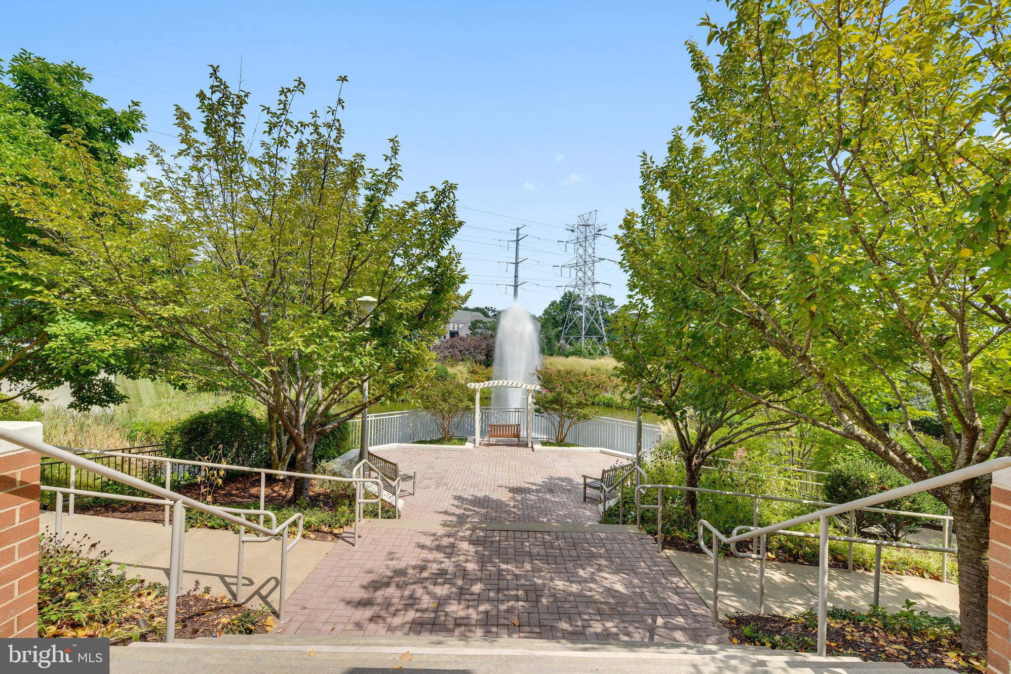11800 Sunset Hills Road, Unit 712 Reston, VA 20190 - Photo 30 of 35 A fountain, seating and walking trail