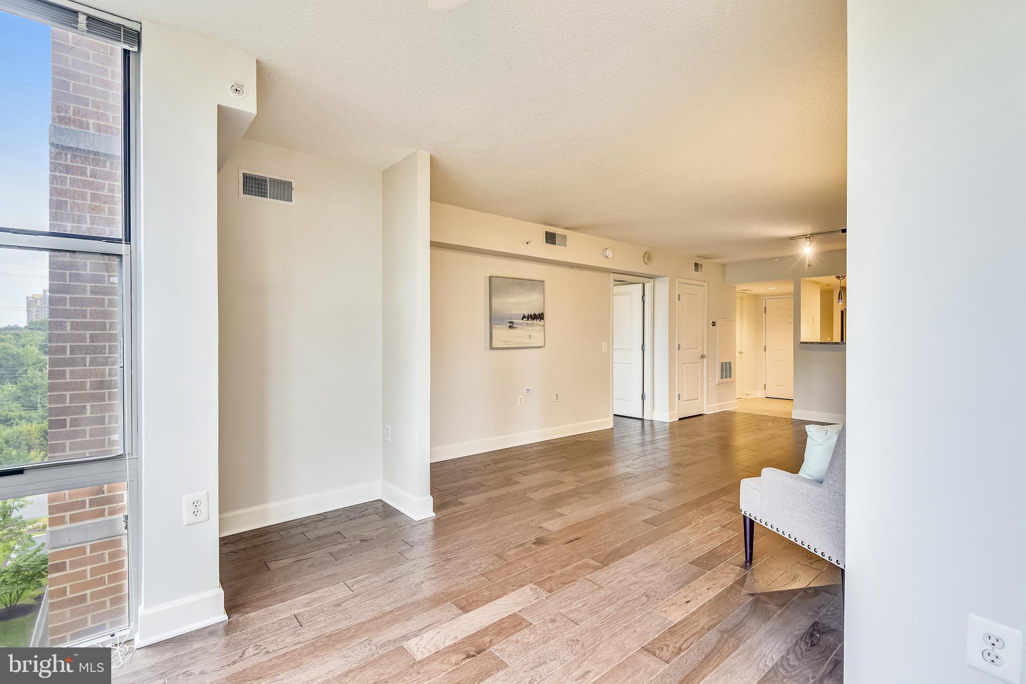 11800 Sunset Hills Road, Unit 712 Reston, VA 20190 - Photo 5 of 35 View #3 - Sunroom to living room