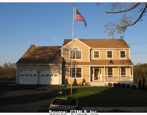 684 Laurel Grove Road Middletown, CT 06457 - Photo 1 of 1 a front view of a house with a garden