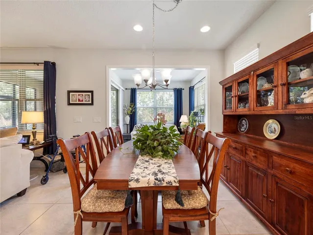 a view of a dining room with furniture and window
