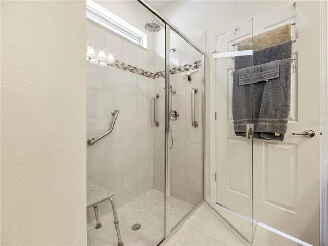 a bathroom with a shower and a sink