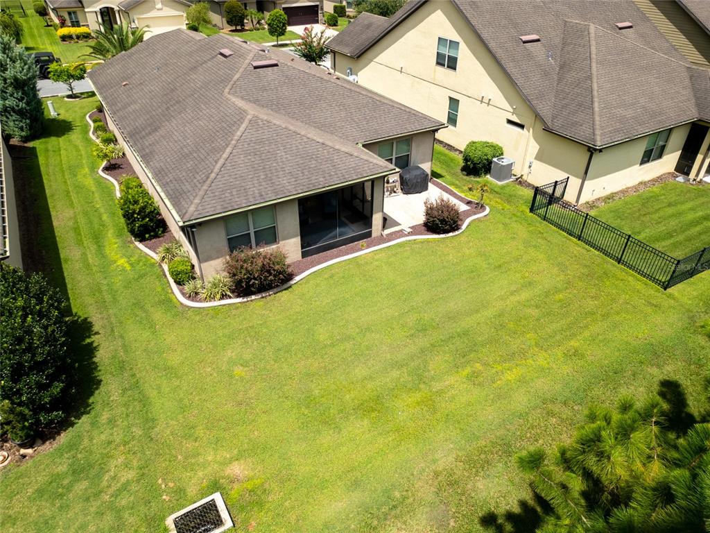 7807 Southwest 97th Circle Ocala, FL 34481 - Photo 46 of 50 a aerial view of a house with table and chairs