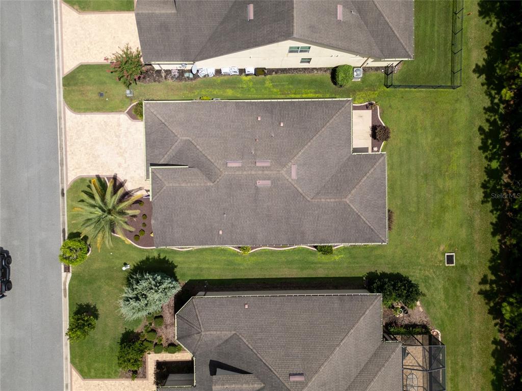 7807 Southwest 97th Circle Ocala, FL 34481 - Photo 47 of 50 an aerial view of a house with a garden and a yard