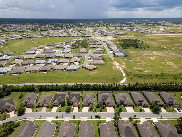 a view of swimming pool and an outdoor seating