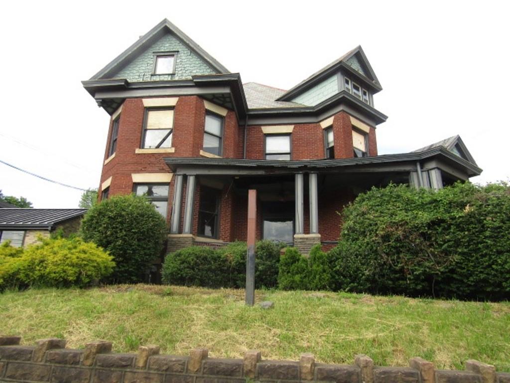246 West Main Street Uniontown, PA 15401 - Photo 1 of 42 a front view of a house with a yard