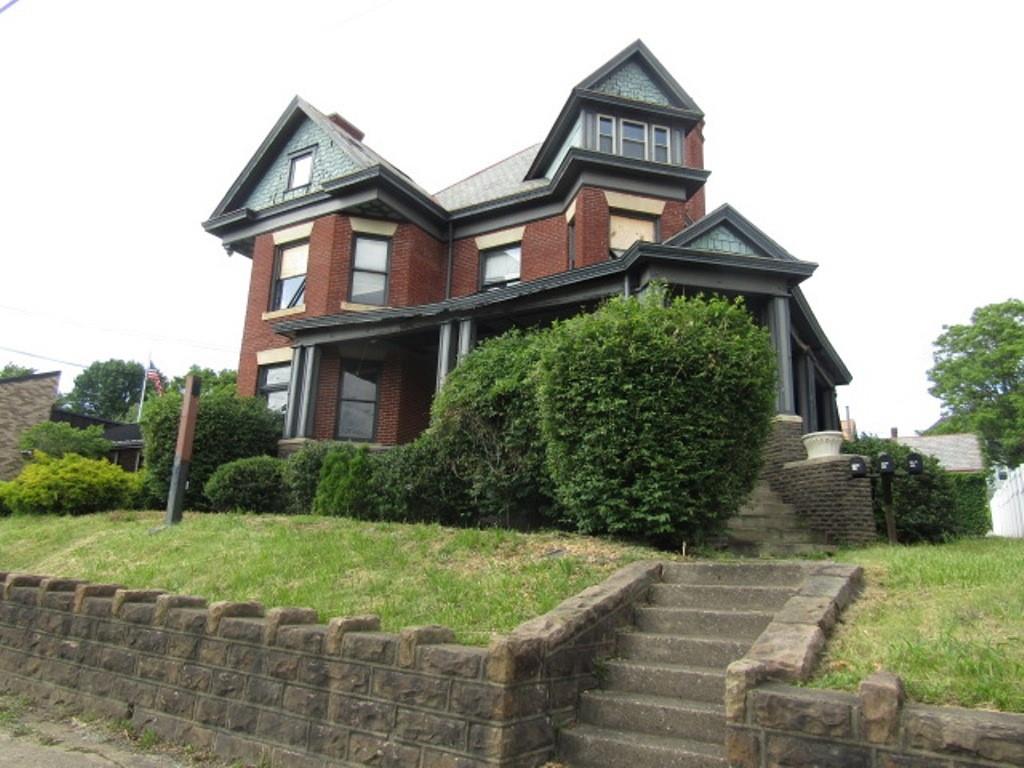 246 West Main Street Uniontown, PA 15401 - Photo 3 of 42 a front view of a house with a yard