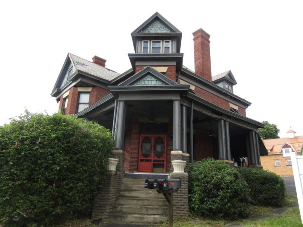 246 West Main Street Uniontown, PA 15401 - Photo 4 of 42 a front view of a house with garden