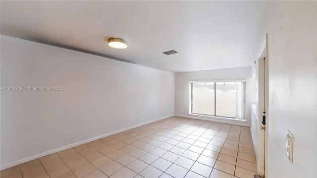 a view of an empty room with window