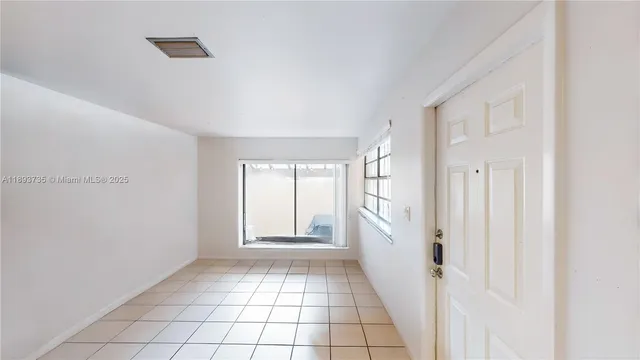 a kitchen with stainless steel appliances a refrigerator a sink a stove a microwave and cabinets