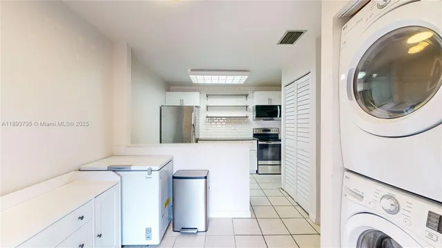 a bathroom with a sink a toilet a mirror and shower