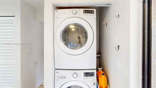 a bathroom with a glass shower door and a glass door