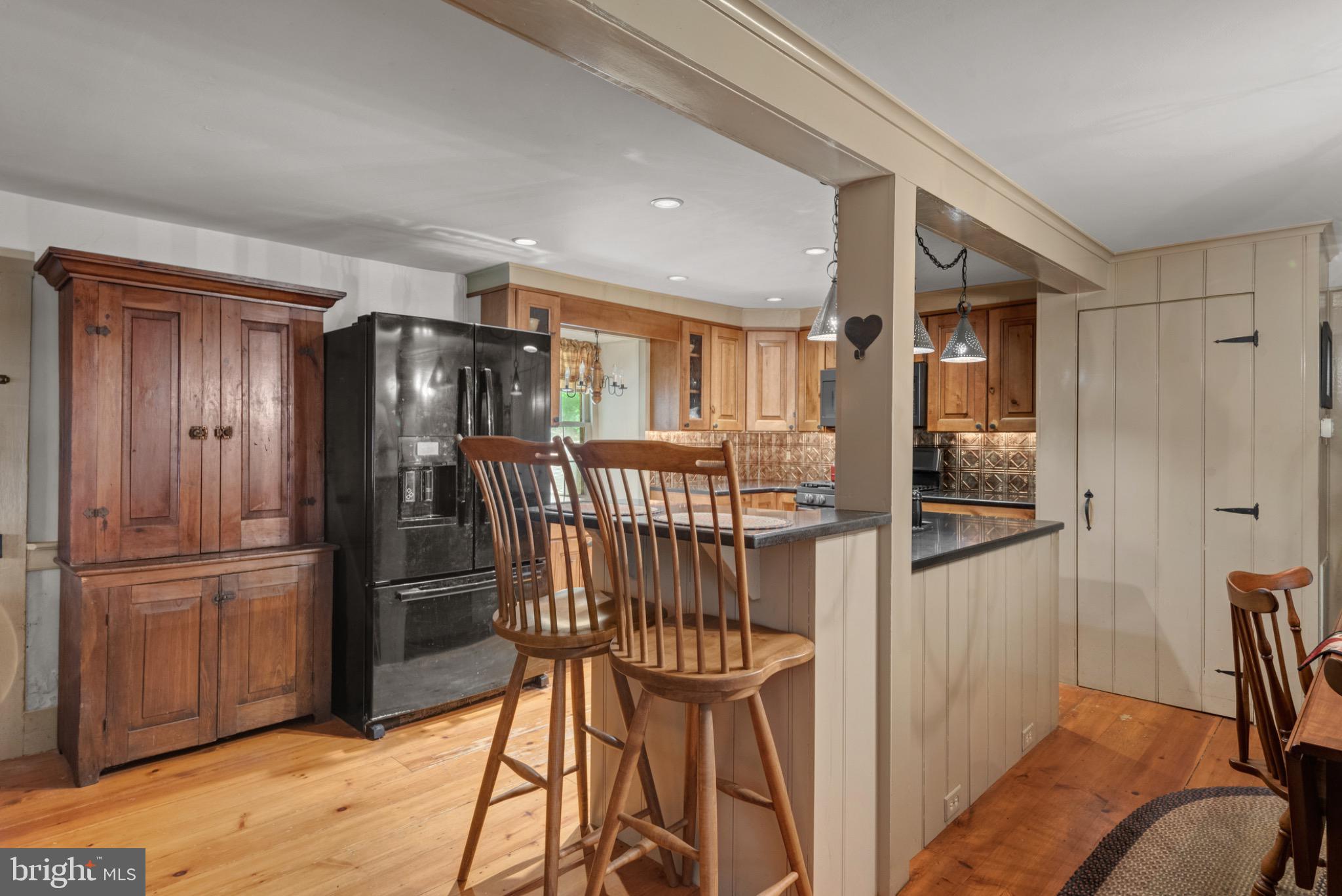 1592 White Oak Road Strasburg, PA 17579 - Photo 11 of 68 a kitchen with stainless steel appliances granite countertop a refrigerator and a stove top oven