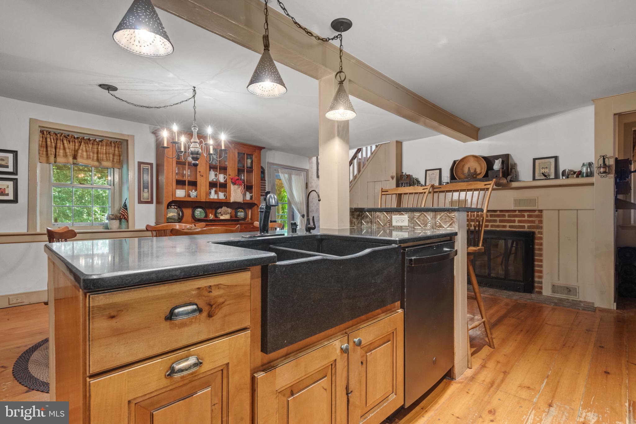 1592 White Oak Road Strasburg, PA 17579 - Photo 14 of 68 a kitchen with kitchen island granite countertop a stove and a wooden floors