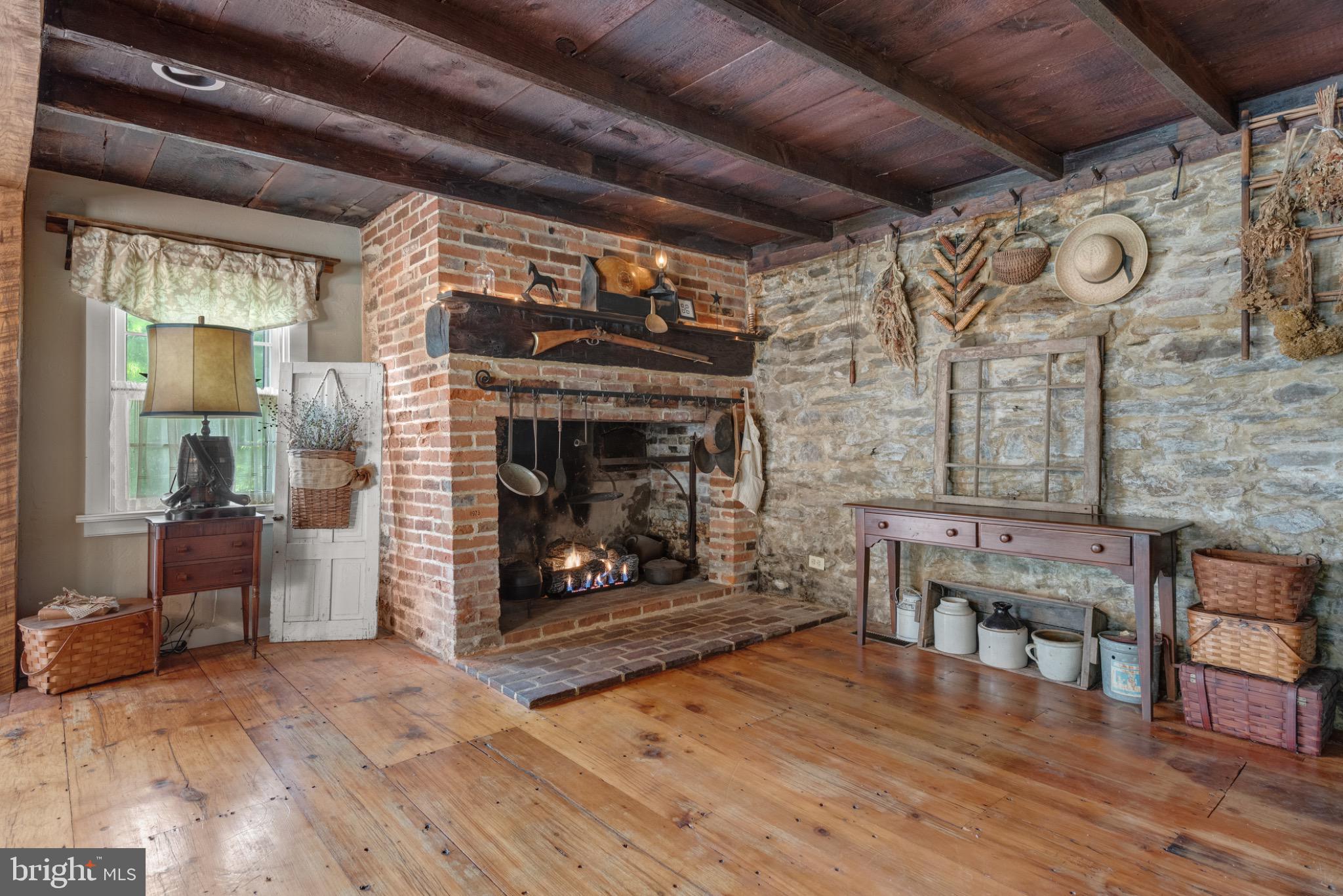 1592 White Oak Road Strasburg, PA 17579 - Photo 26 of 68 a living room with furniture and a fireplace