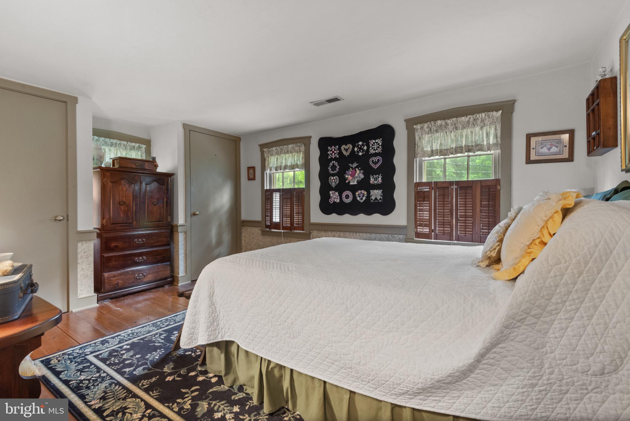 1592 White Oak Road Strasburg, PA 17579 - Photo 44 of 68 a bedroom with a bed and wooden floor