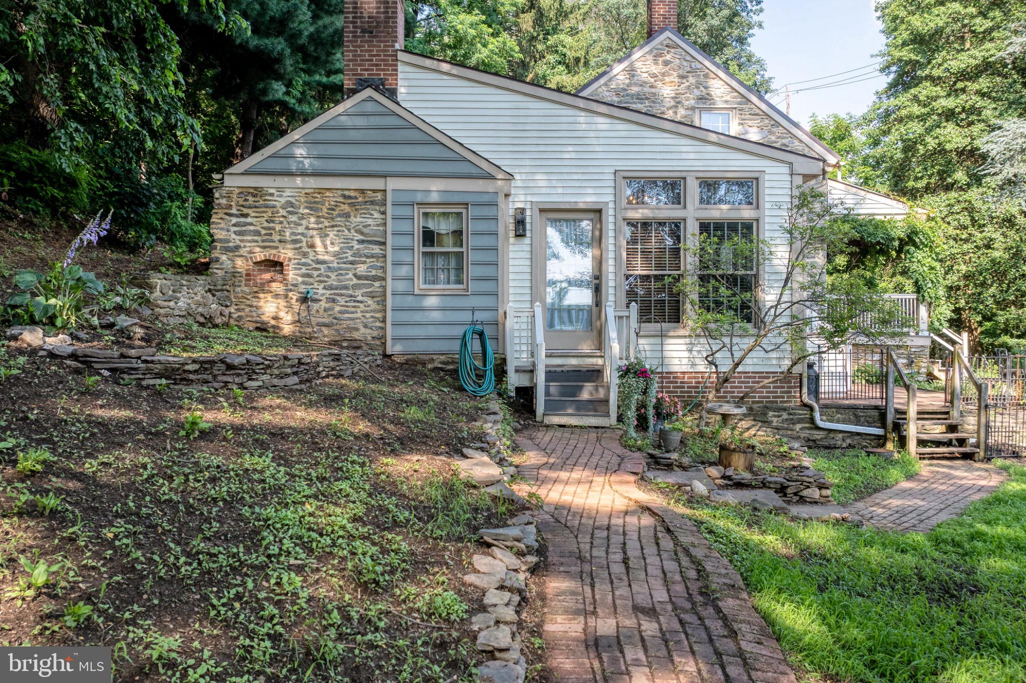 1592 White Oak Road Strasburg, PA 17579 - Photo 45 of 68 Charming stone cottage with lush greenery.