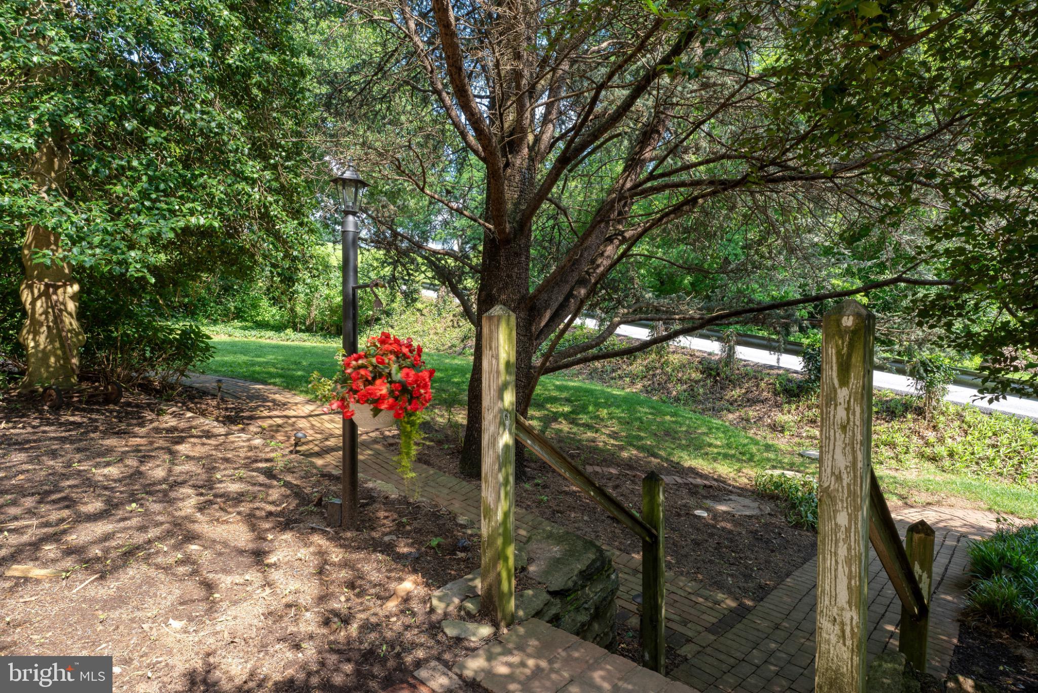 1592 White Oak Road Strasburg, PA 17579 - Photo 48 of 68 Serene garden path with vibrant blooms.