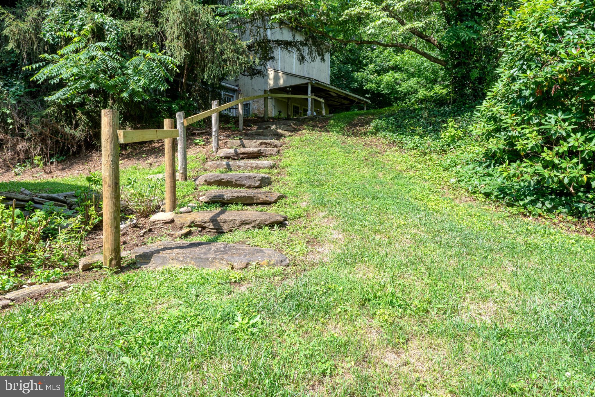 1592 White Oak Road Strasburg, PA 17579 - Photo 49 of 68 a view of a garden with a bench in a garden