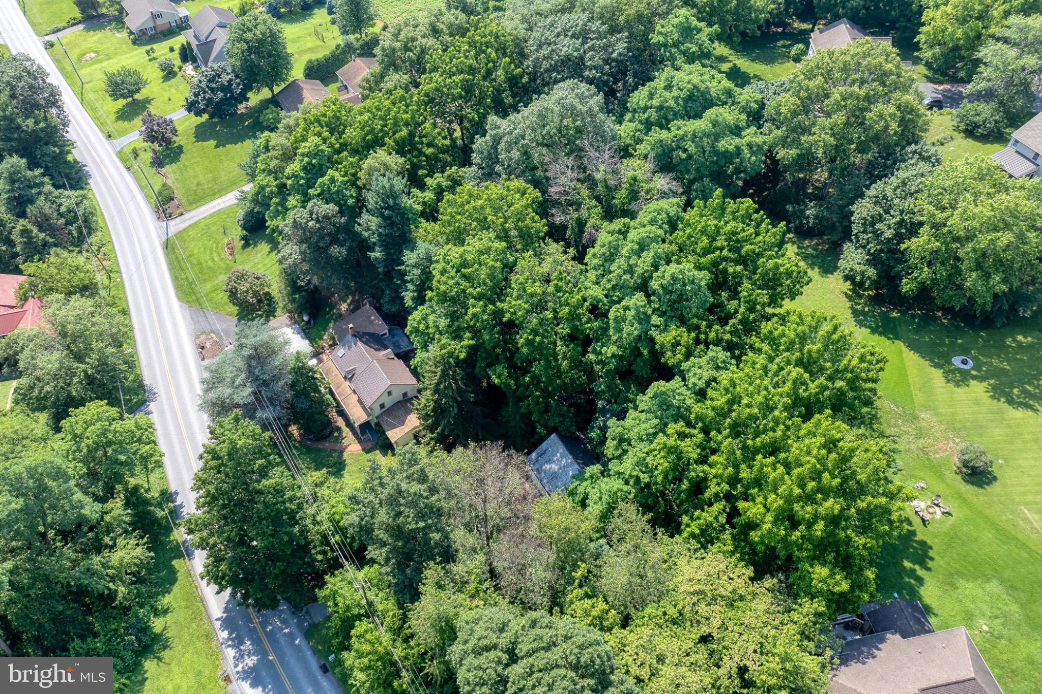 1592 White Oak Road Strasburg, PA 17579 - Photo 58 of 68 an aerial view of residential house with outdoor space and trees all around