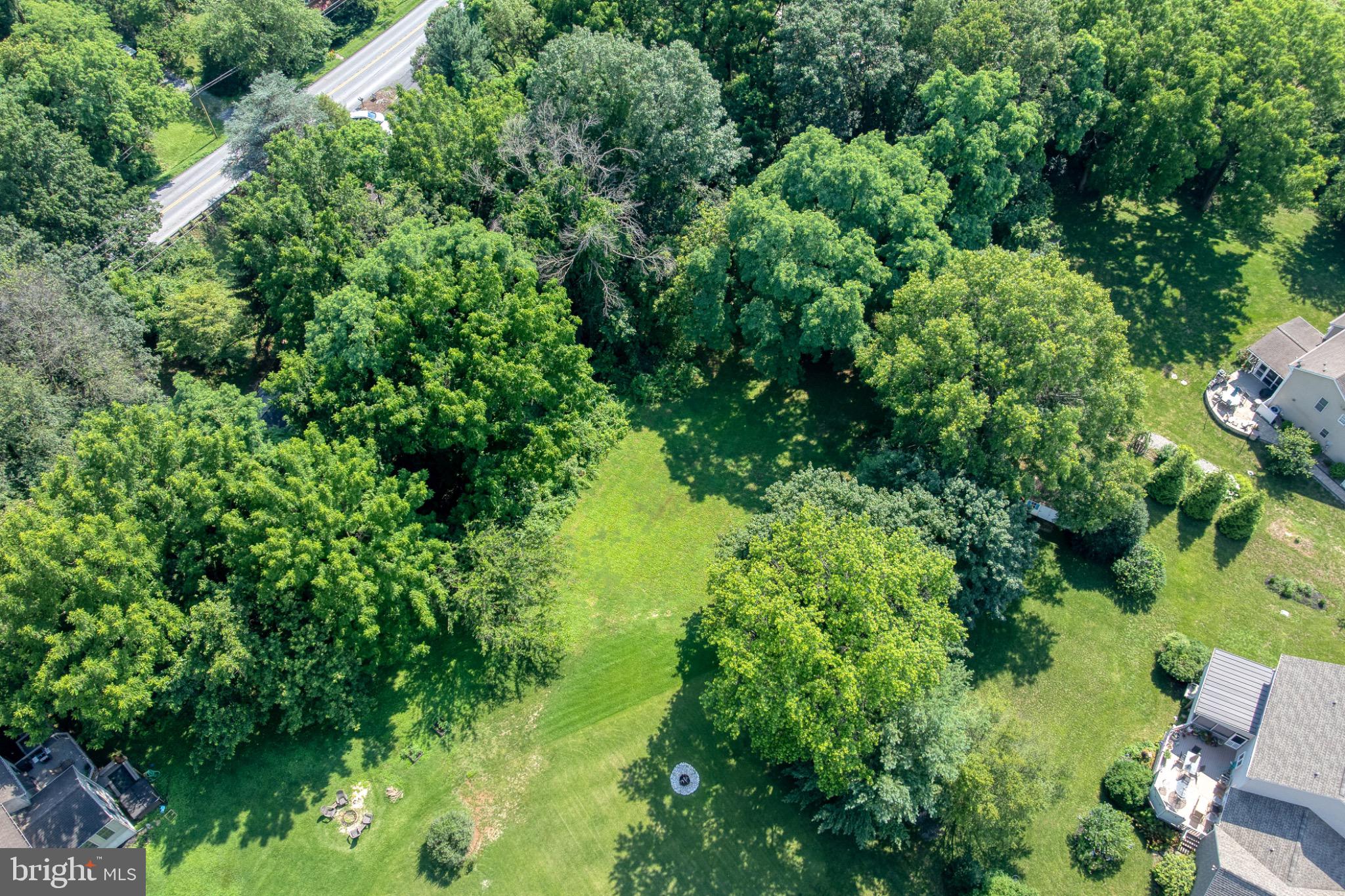 1592 White Oak Road Strasburg, PA 17579 - Photo 59 of 68 Lush greenery surrounds a tranquil space.