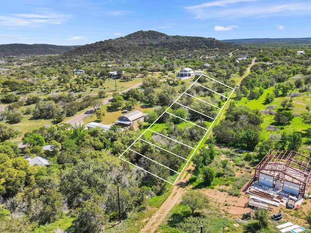 a view of a city with mountains in the background