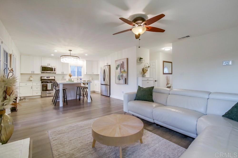 12930 Morene Street Poway, CA 92064 - Photo 16 of 26 a living room with furniture and kitchen view