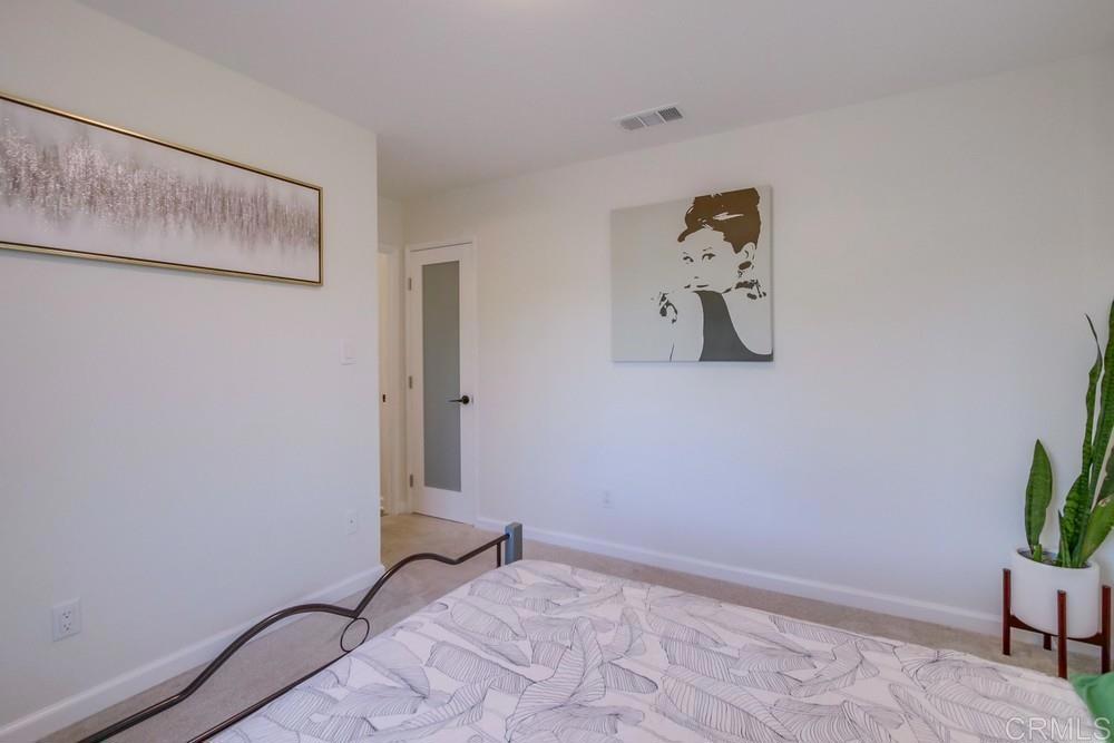12930 Morene Street Poway, CA 92064 - Photo 20 of 26 a view of room with window and wooden floor